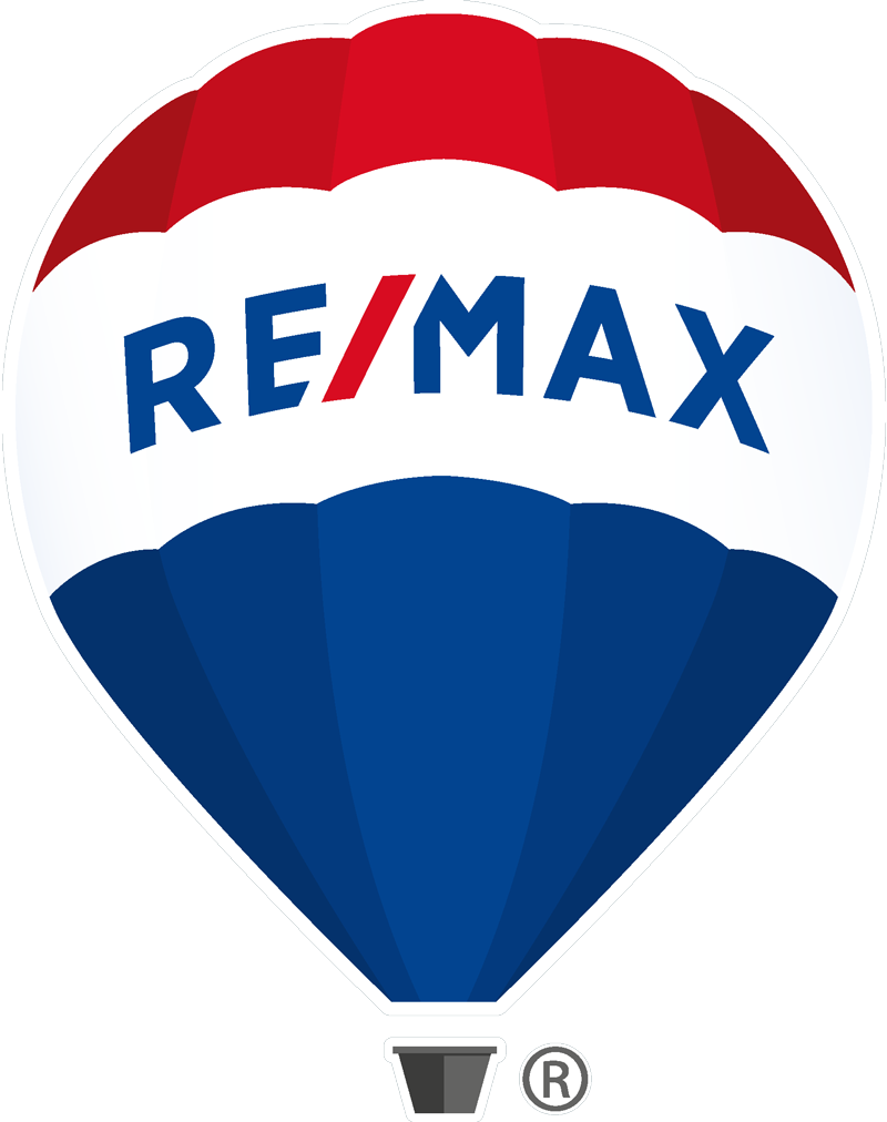 RE/MAX hot air balloon floating over the British Columbia mountains